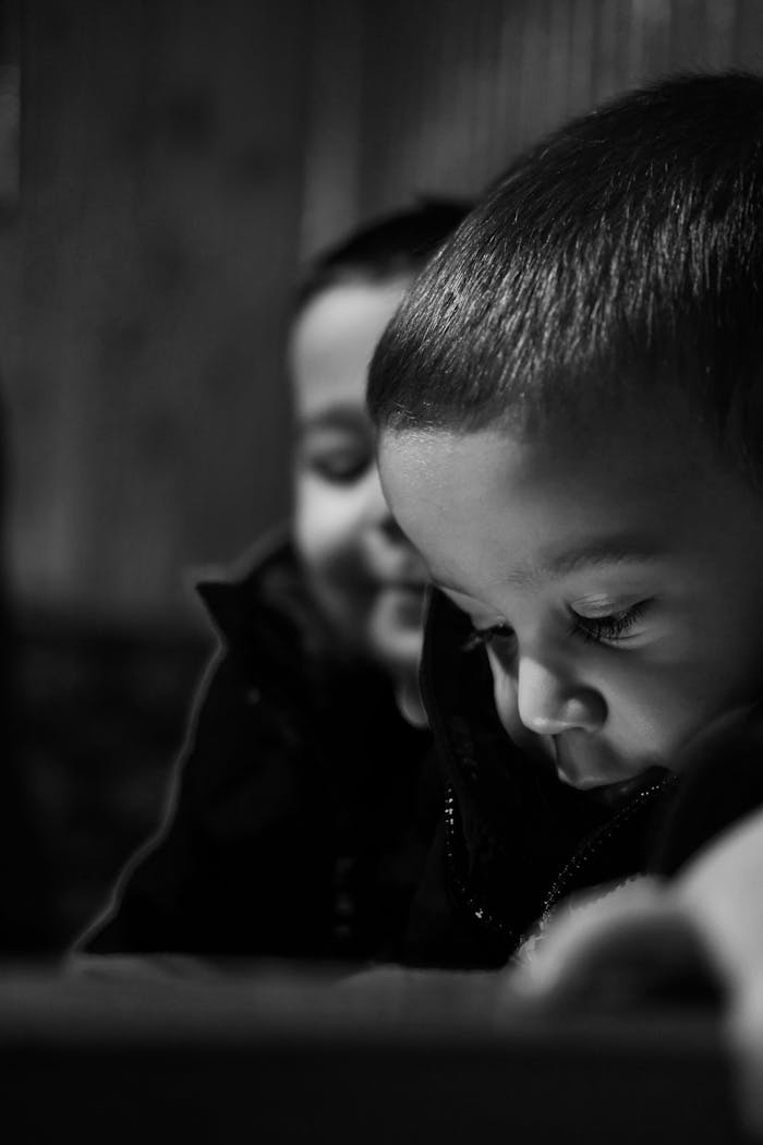 who-we-are Black and white close-up of a thoughtful child in Ankara, Turkey. Captures emotion and focus.